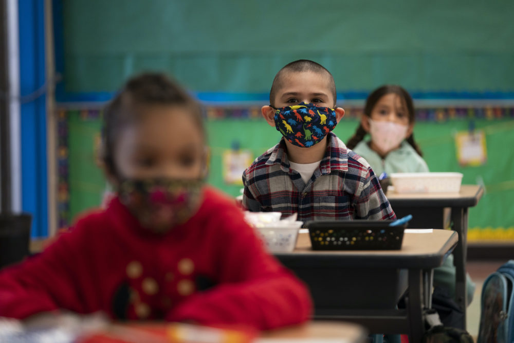 Kindergarten students sit in their classroom on the first day of in-person learning at Maurice Sendak Elementary School in Los Angeles, Tuesday, April 13, 2021. More than a year after the pandemic forced all of California's schools to close classroom doors, some of the state's largest school districts are slowly beginning to reopen this week for in-person instruction. (AP Photo/Jae C. Hong)